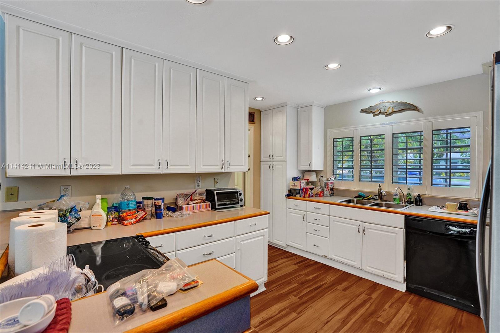 9020 Southwest 187th Terrace Cutler Bay, FL 33157 - Photo 17 of 55 a kitchen with stainless steel appliances granite countertop a sink and cabinets