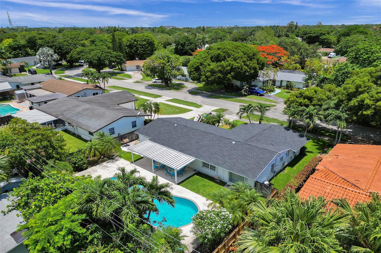 9020 Southwest 187th Terrace Cutler Bay, FL 33157 - Photo 2 of 55 an aerial view of a house with a garden