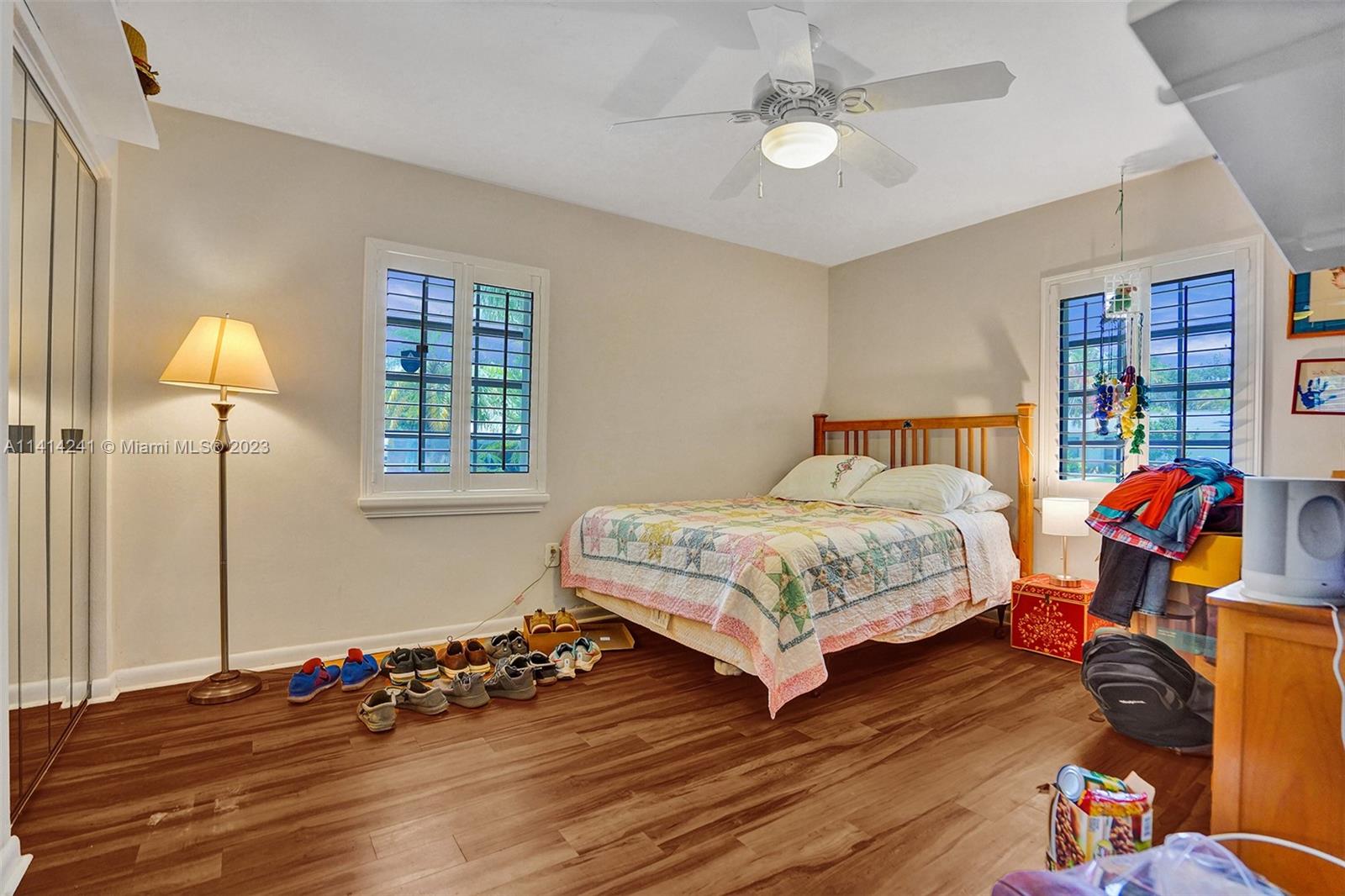 9020 Southwest 187th Terrace Cutler Bay, FL 33157 - Photo 29 of 55 a bedroom with a bed and wooden floor