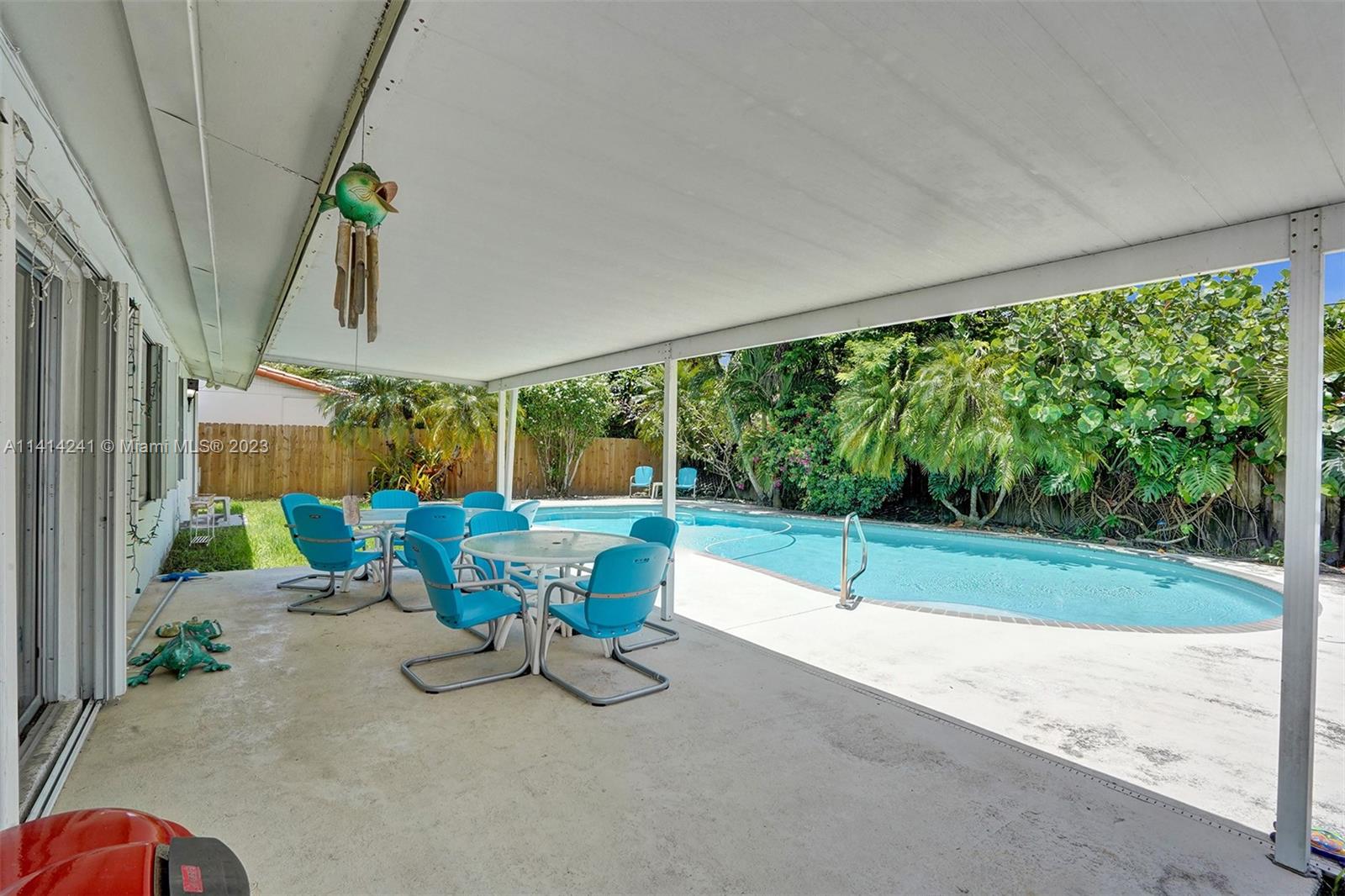 9020 Southwest 187th Terrace Cutler Bay, FL 33157 - Photo 32 of 55 a view of a two chairs in a patio