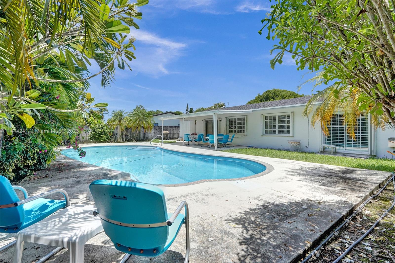 9020 Southwest 187th Terrace Cutler Bay, FL 33157 - Photo 34 of 55 a view of a house with pool and sitting area