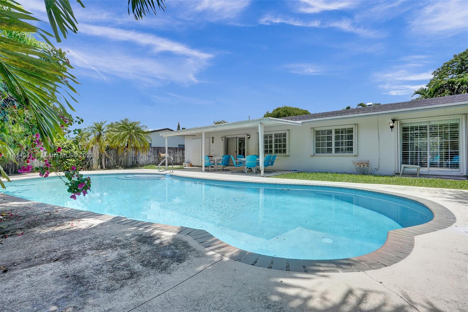 9020 Southwest 187th Terrace Cutler Bay, FL 33157 - Photo 35 of 55 a view of a house with swimming pool