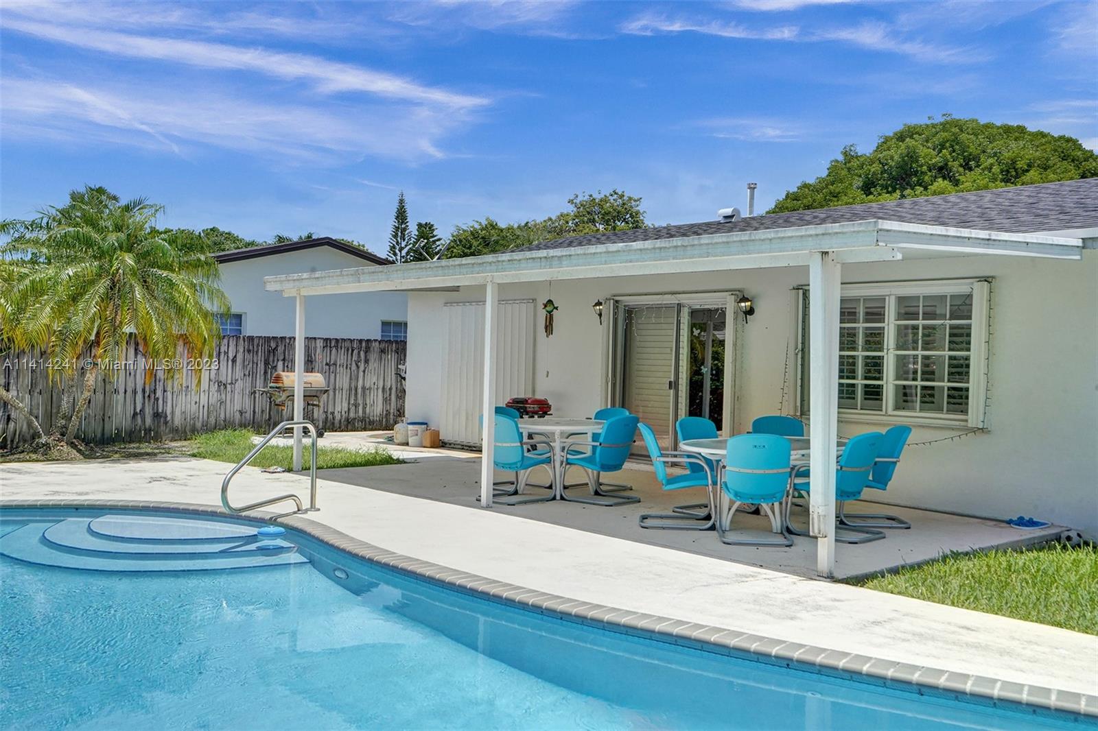 9020 Southwest 187th Terrace Cutler Bay, FL 33157 - Photo 36 of 55 a view of a house with backyard and sitting area