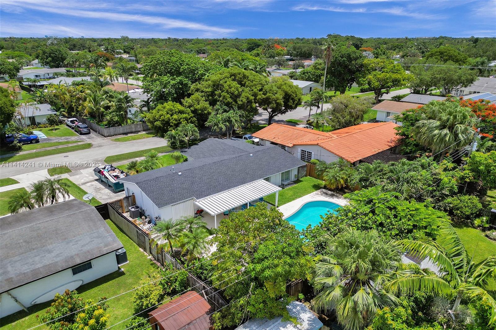 9020 Southwest 187th Terrace Cutler Bay, FL 33157 - Photo 44 of 55 an aerial view of a house with a yard and lake view