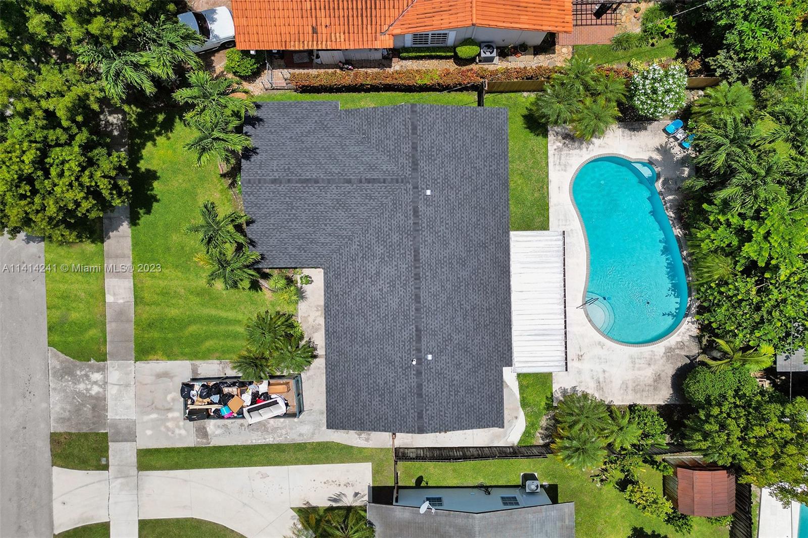 9020 Southwest 187th Terrace Cutler Bay, FL 33157 - Photo 45 of 55 an aerial view of a house with a swimming pool