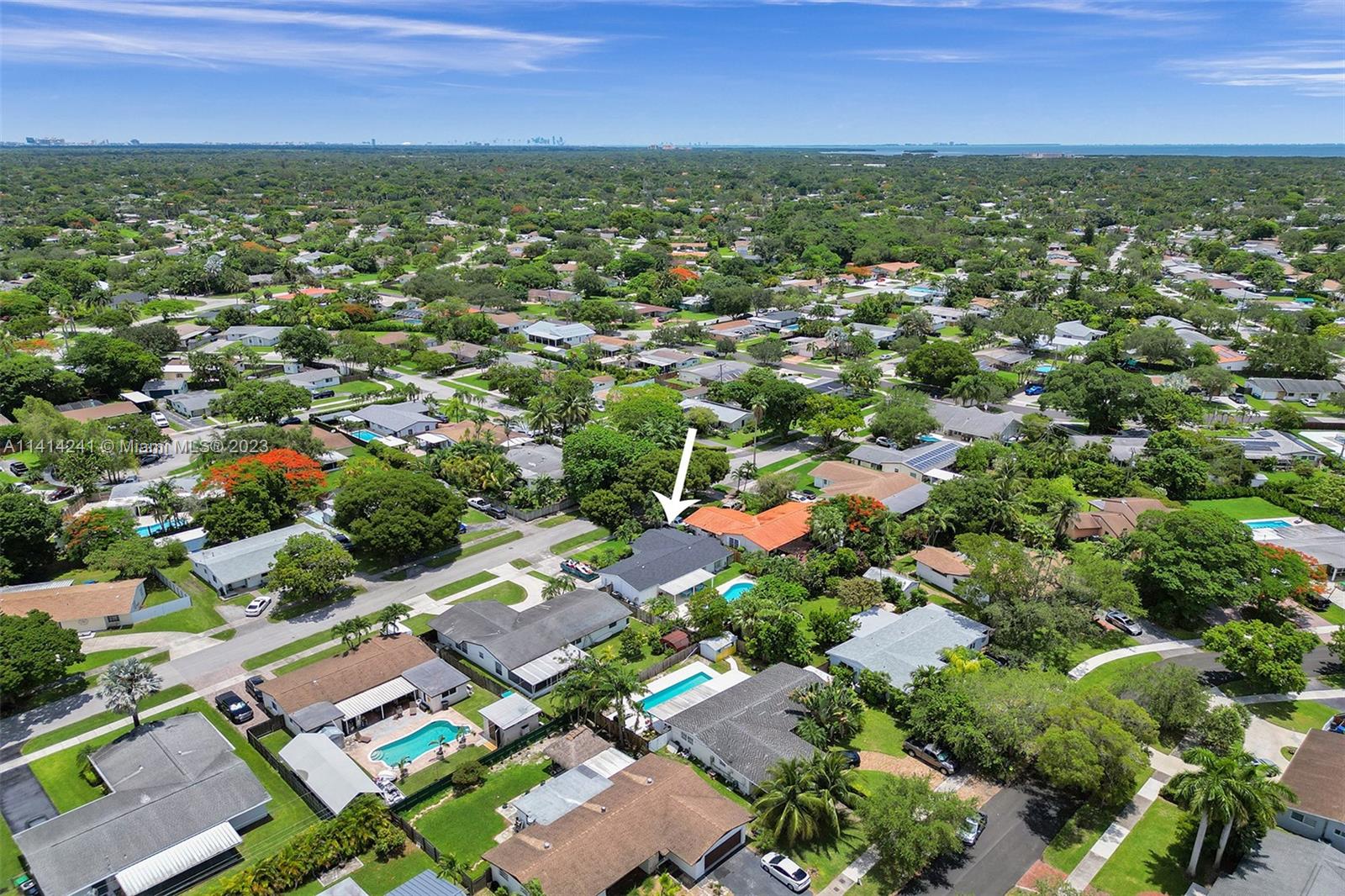 9020 Southwest 187th Terrace Cutler Bay, FL 33157 - Photo 49 of 55 an aerial view of residential houses with outdoor space and trees