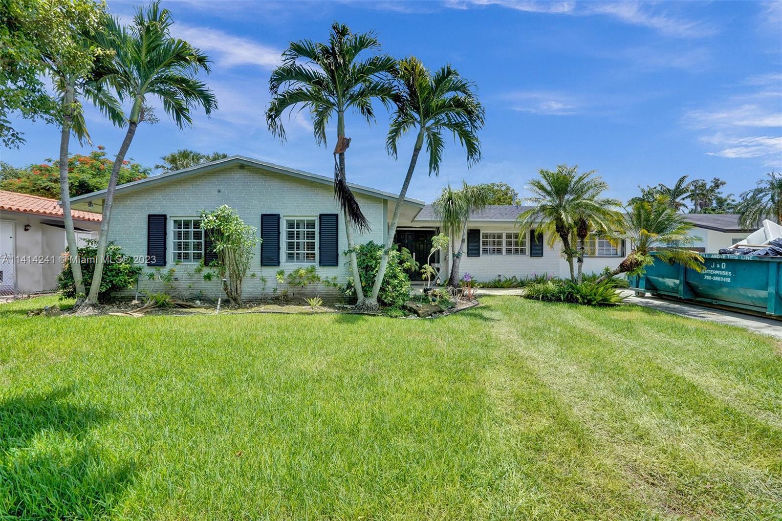 9020 Southwest 187th Terrace Cutler Bay, FL 33157 - Photo 52 of 55 a front view of house with yard and green space