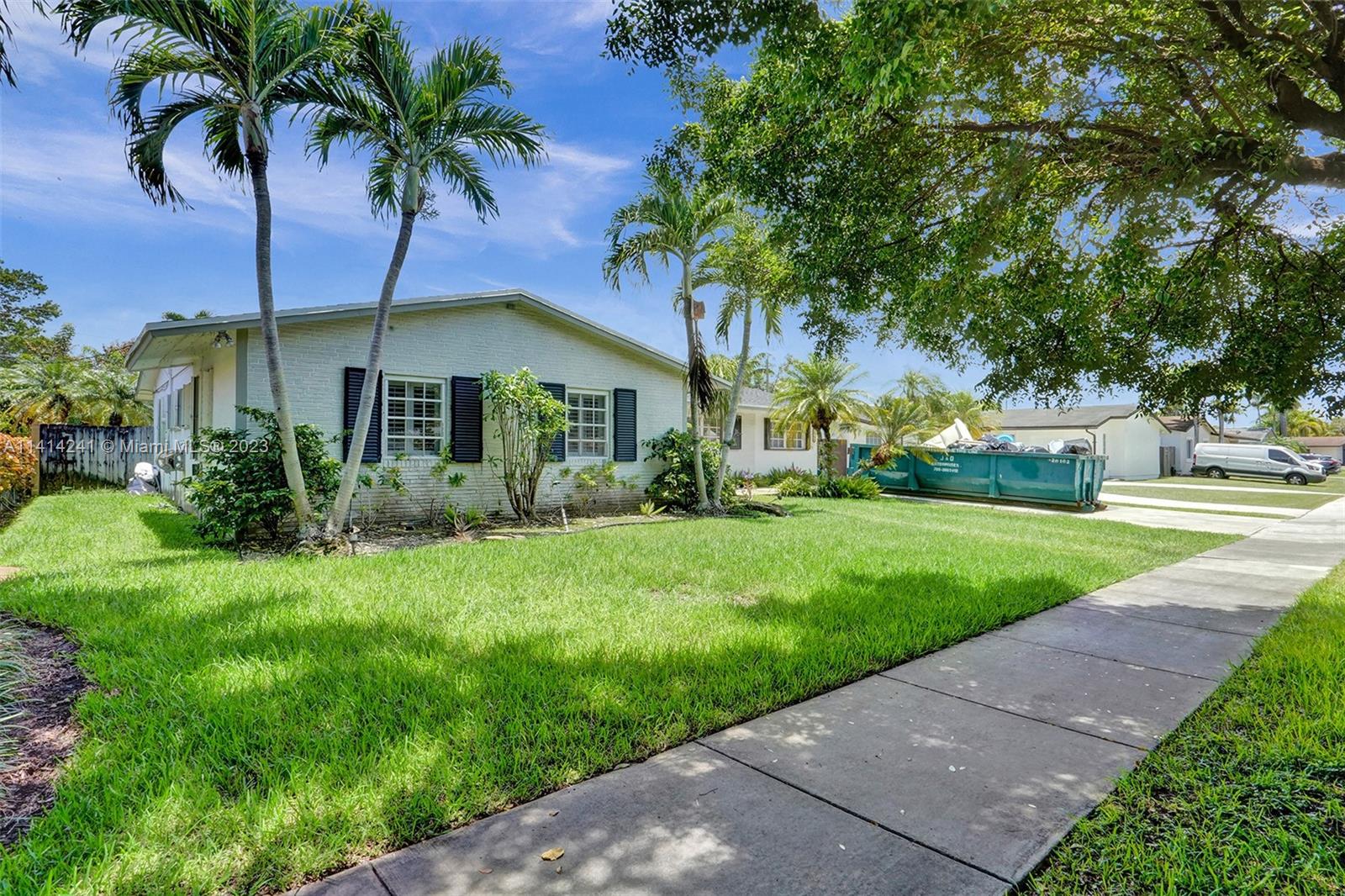 9020 Southwest 187th Terrace Cutler Bay, FL 33157 - Photo 55 of 55 a front view of house with yard and green space