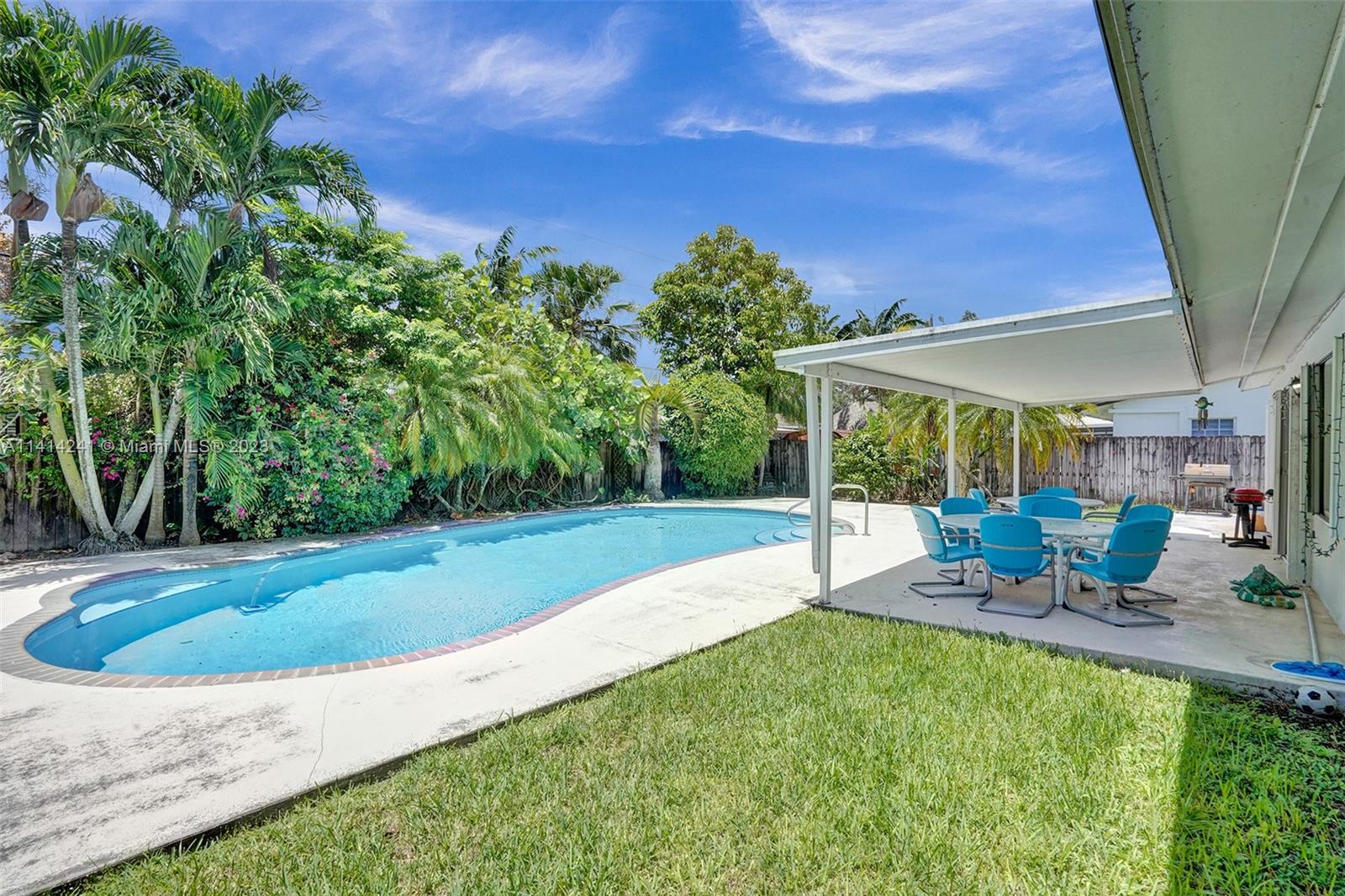 9020 Southwest 187th Terrace Cutler Bay, FL 33157 - Photo 8 of 55 a view of a backyard with sitting area