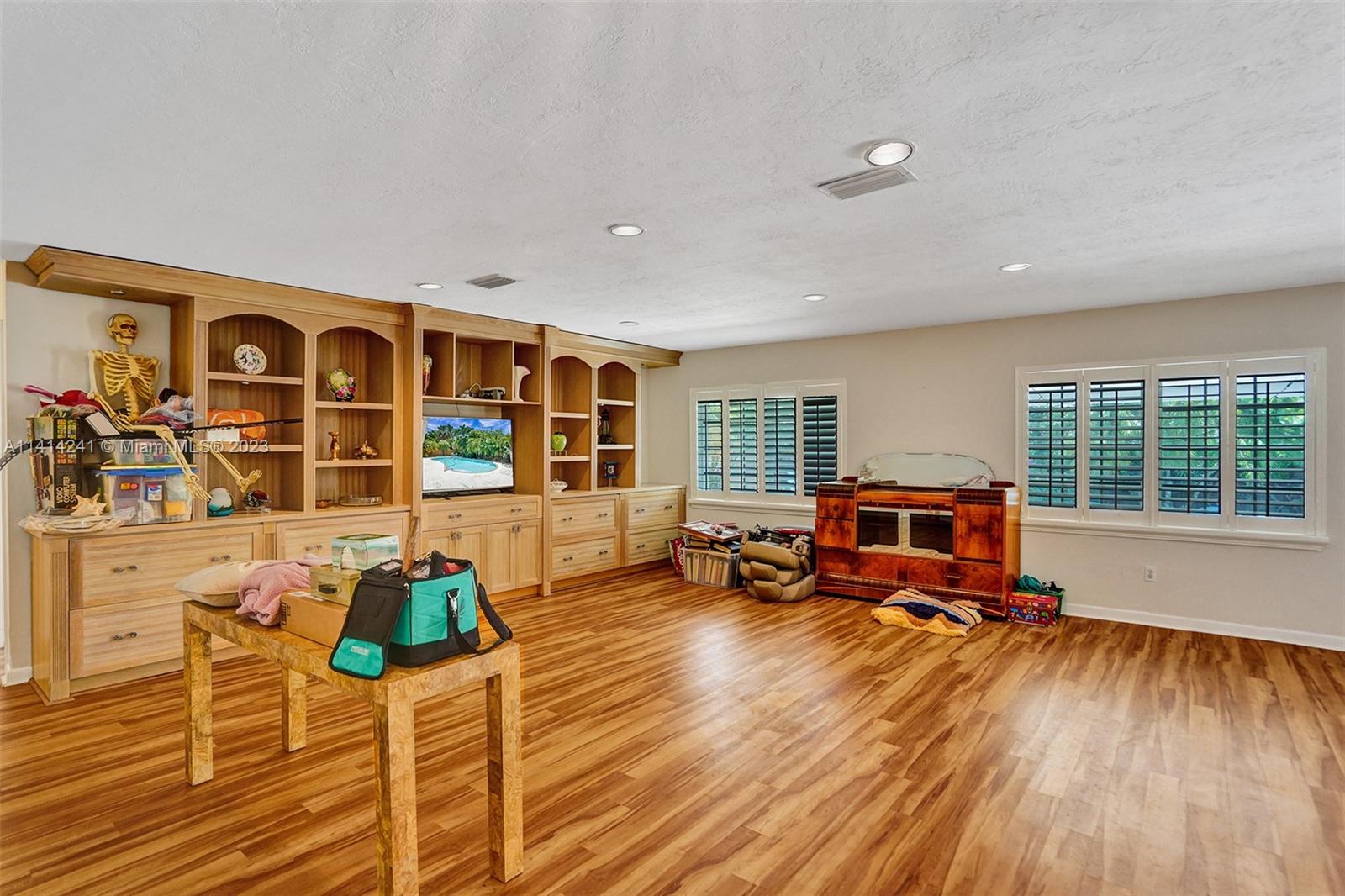 9020 Southwest 187th Terrace Cutler Bay, FL 33157 - Photo 9 of 55 a living room with furniture window and wooden floor