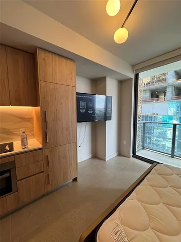 a spacious bathroom with a bathtub and a toilet