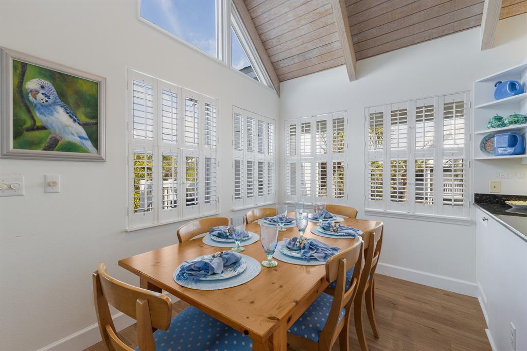 5000 Gasparilla Road, Unit VH37 Boca Grande, FL 33921 - Photo 11 of 54 a dining room with furniture and window