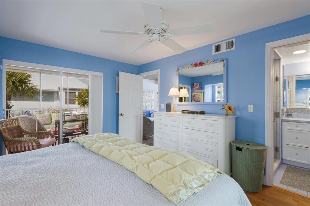 5000 Gasparilla Road, Unit VH37 Boca Grande, FL 33921 - Photo 19 of 54 a bedroom with a bed and a dresser