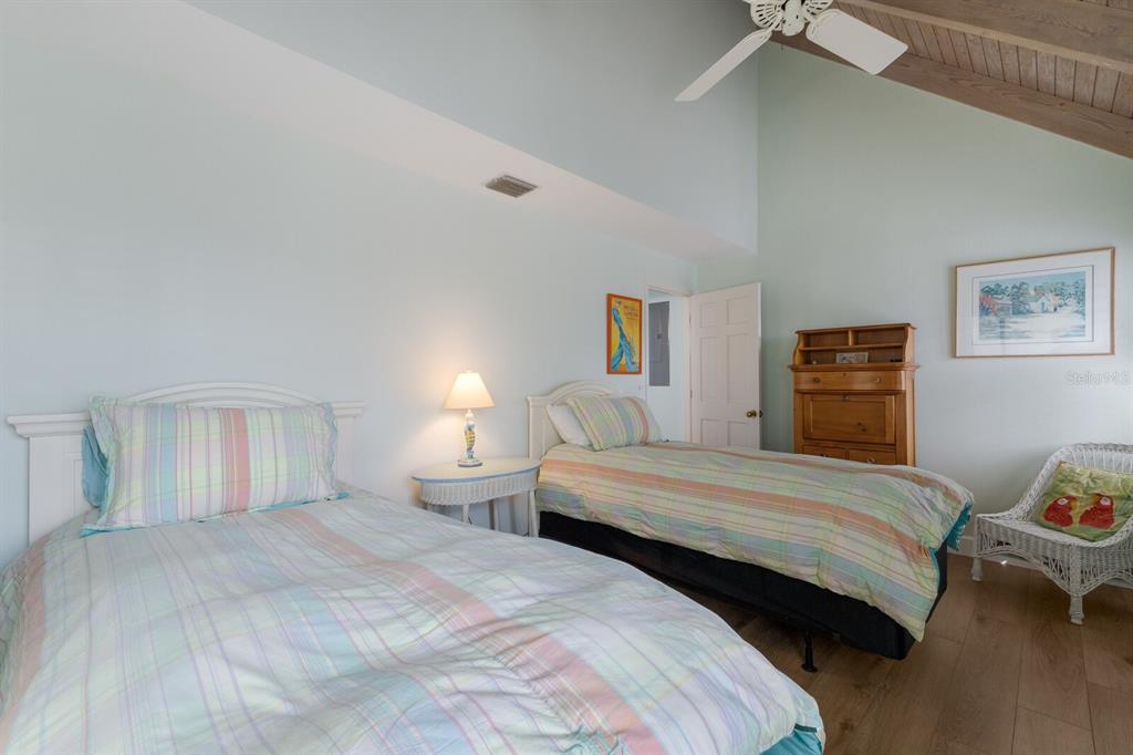 5000 Gasparilla Road, Unit VH37 Boca Grande, FL 33921 - Photo 21 of 54 a bedroom with a bed and a window