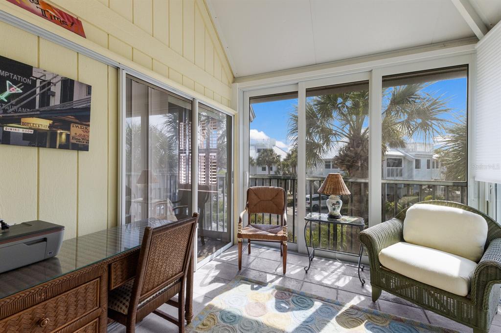 5000 Gasparilla Road, Unit VH37 Boca Grande, FL 33921 - Photo 24 of 54 a living room with furniture and a floor to ceiling window