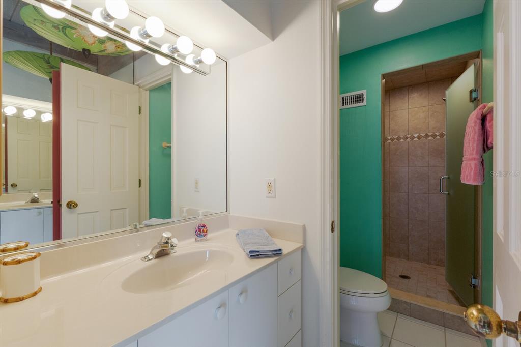 5000 Gasparilla Road, Unit VH37 Boca Grande, FL 33921 - Photo 26 of 54 a bathroom with a sink a toilet and shower