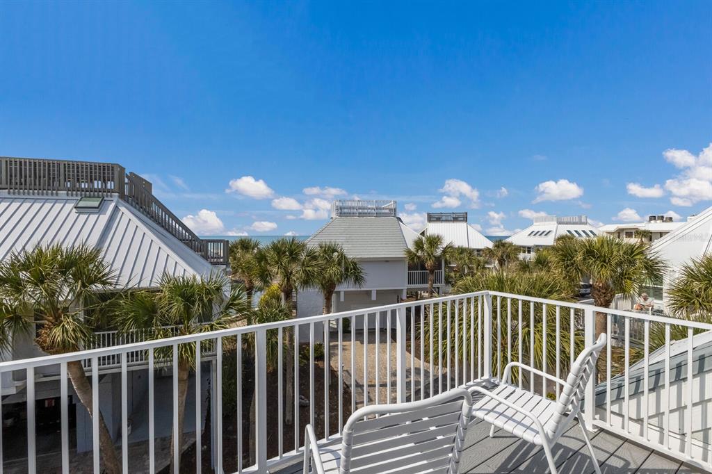 5000 Gasparilla Road, Unit VH37 Boca Grande, FL 33921 - Photo 29 of 54 a view of a balcony with a yard