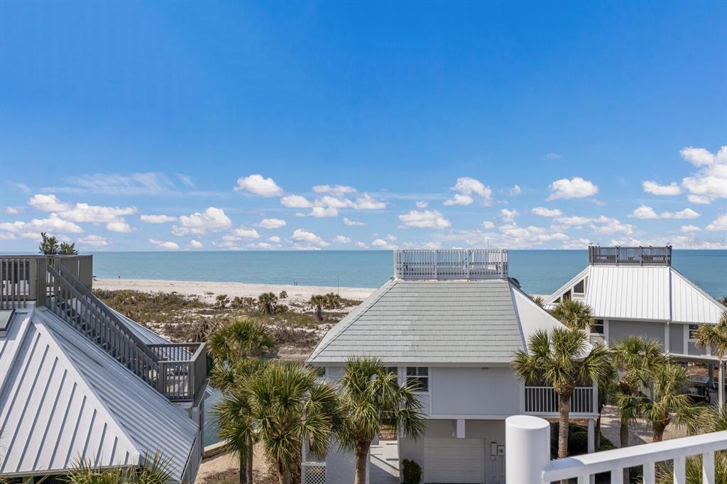 5000 Gasparilla Road, Unit VH37 Boca Grande, FL 33921 - Photo 30 of 54 a view of a balcony with an outdoor seating
