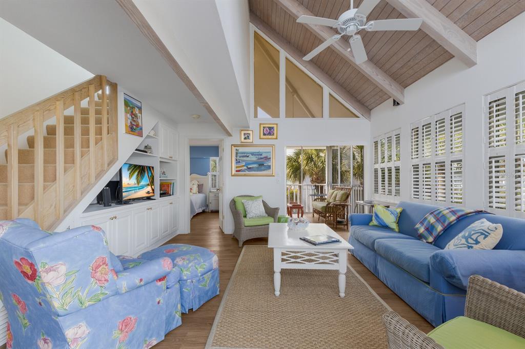 5000 Gasparilla Road, Unit VH37 Boca Grande, FL 33921 - Photo 7 of 54 a living room with furniture and a flat screen tv