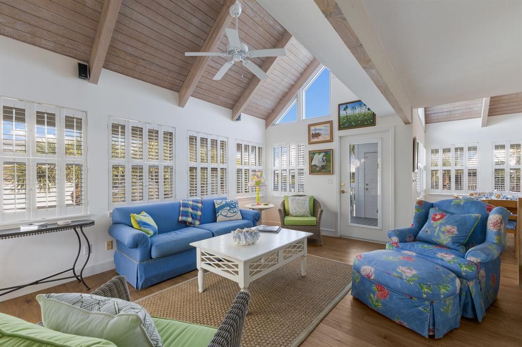 5000 Gasparilla Road, Unit VH37 Boca Grande, FL 33921 - Photo 8 of 54 a living room with furniture and a large window