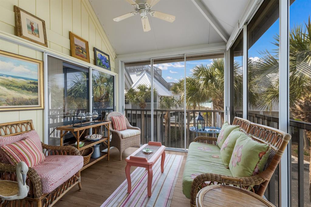 5000 Gasparilla Road, Unit VH37 Boca Grande, FL 33921 - Photo 10 of 54 a living room with furniture tv and a large window
