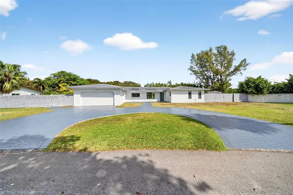 a view of a swimming pool with an outdoor space and seating area