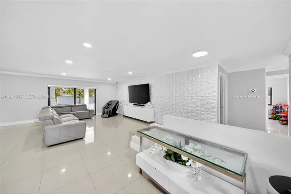 a living room with furniture and a flat screen tv