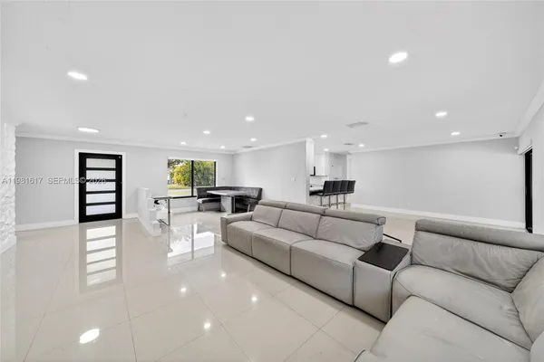 a living room with furniture and a table