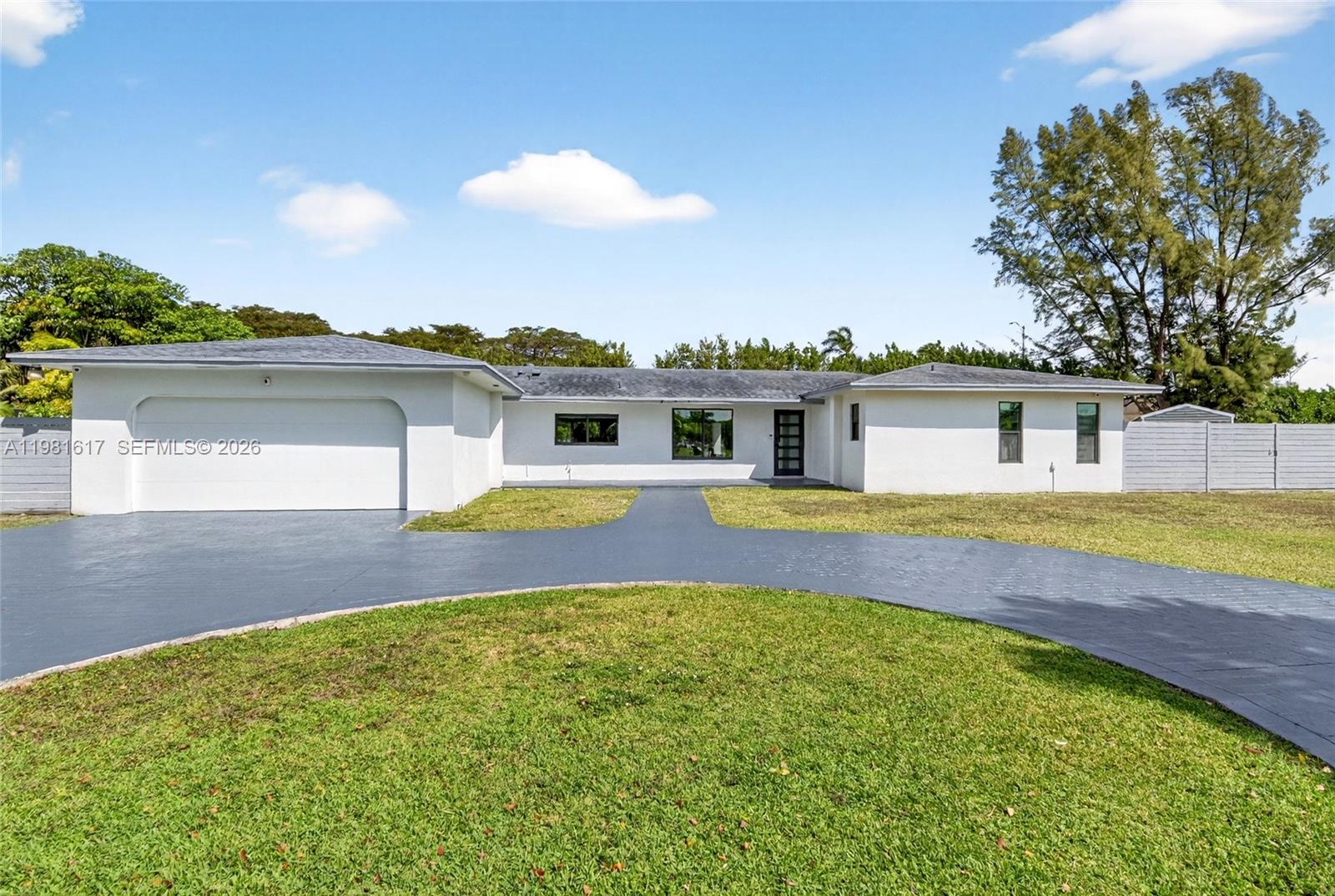 11951 Southwest 120th Terrace Miami, FL 33186 - Photo 2 of 55 a view of a house with swimming pool and a yard