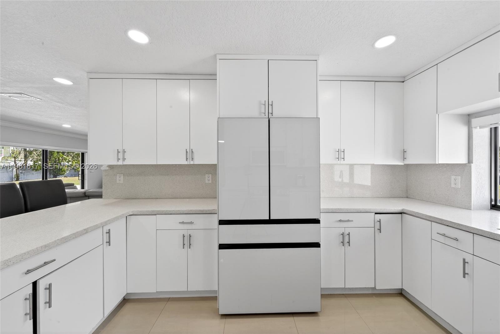 11951 Southwest 120th Terrace Miami, FL 33186 - Photo 22 of 55 a kitchen with white cabinets and white appliances