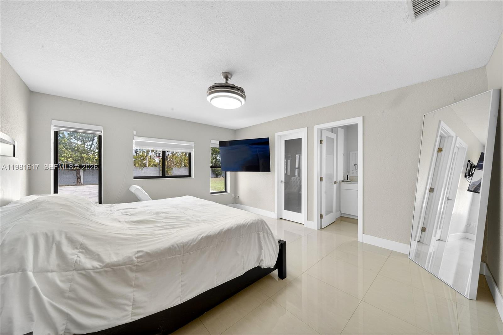 11951 Southwest 120th Terrace Miami, FL 33186 - Photo 24 of 55 a bedroom with a large bed and a dresser