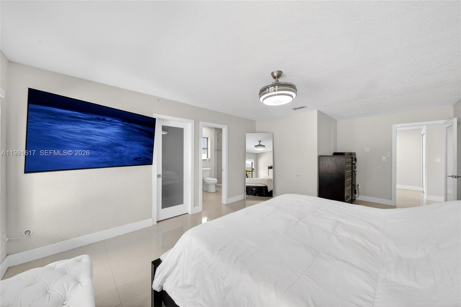 11951 Southwest 120th Terrace Miami, FL 33186 - Photo 25 of 55 a bedroom with a large bed and a window