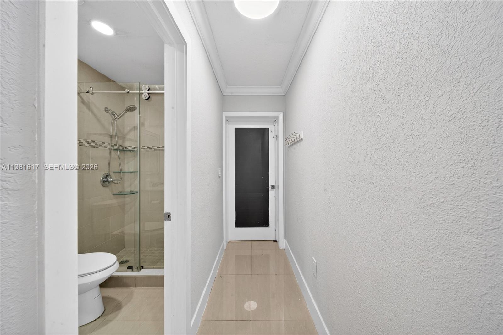 11951 Southwest 120th Terrace Miami, FL 33186 - Photo 28 of 55 a bathroom with a granite countertop toilet a sink and shower
