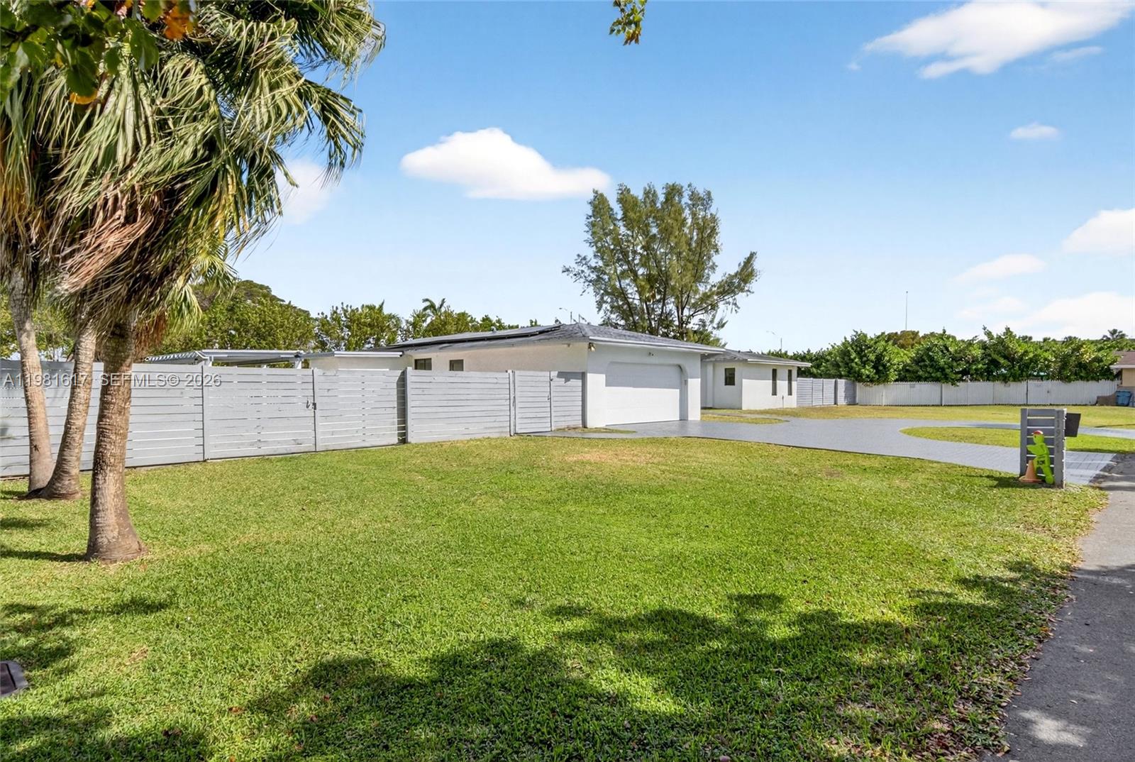 11951 Southwest 120th Terrace Miami, FL 33186 - Photo 3 of 55 a view of yard with swimming pool and seating