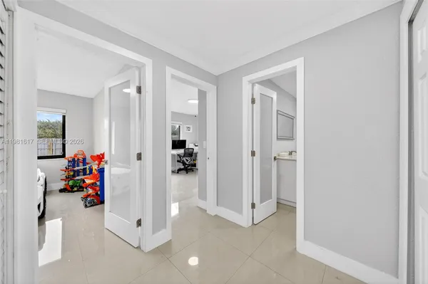 a bathroom with a tub a sink and a shower