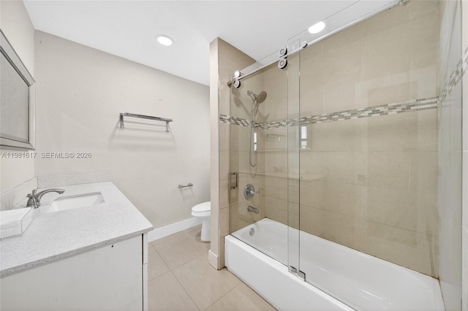 11951 Southwest 120th Terrace Miami, FL 33186 - Photo 34 of 55 a bathroom with a tub a sink and a shower