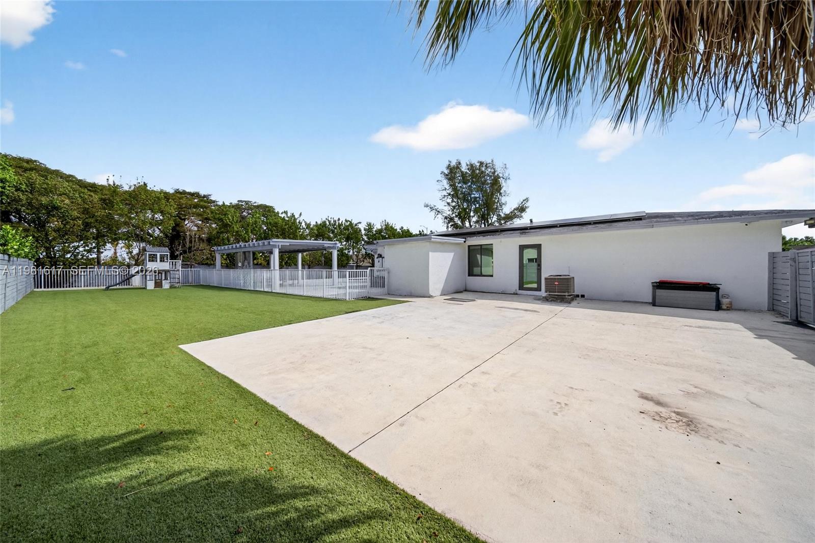 11951 Southwest 120th Terrace Miami, FL 33186 - Photo 40 of 55 a house with swimming pool in front of it