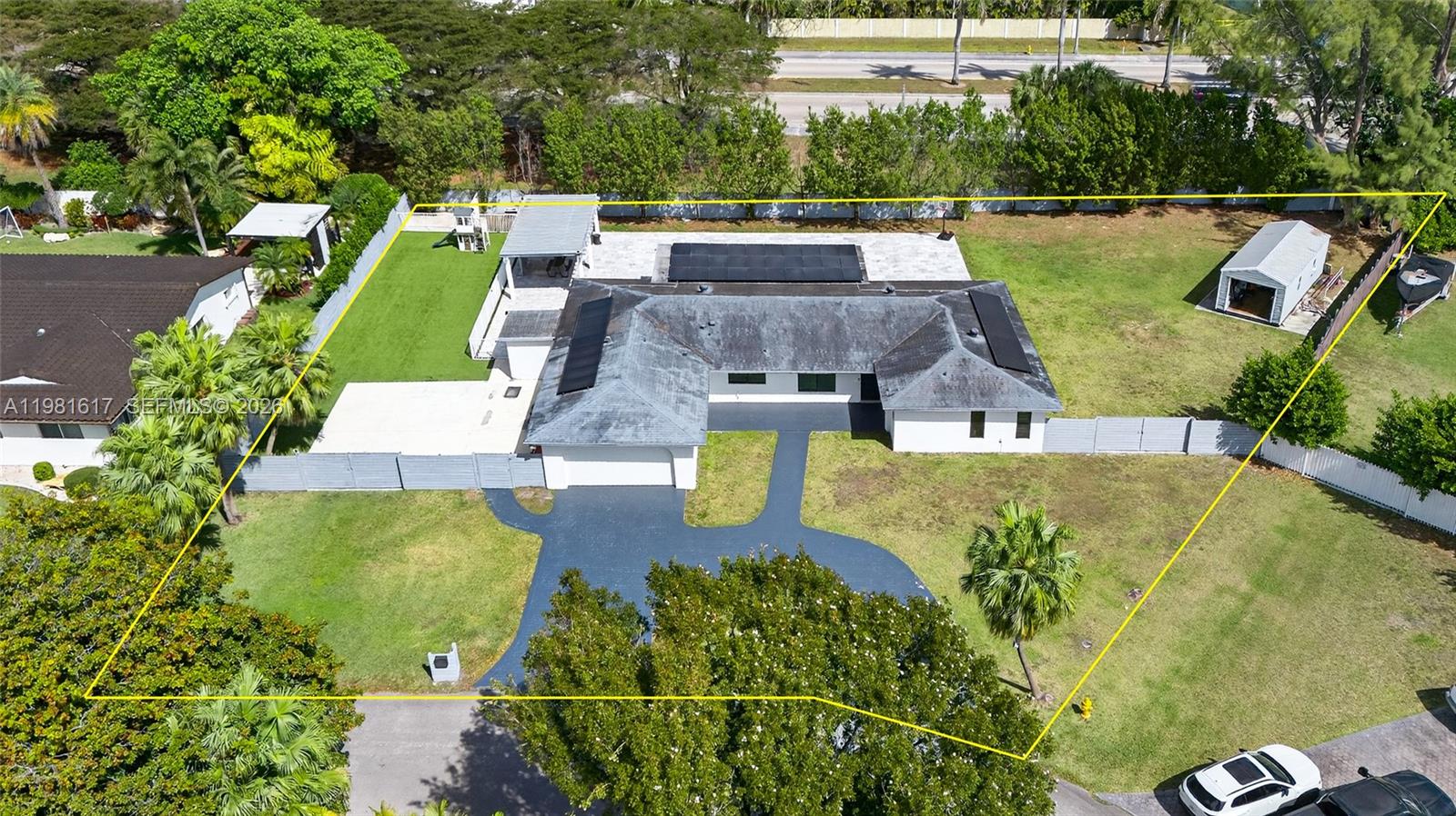 11951 Southwest 120th Terrace Miami, FL 33186 - Photo 4 of 55 an aerial view of a house with swimming pool and large trees