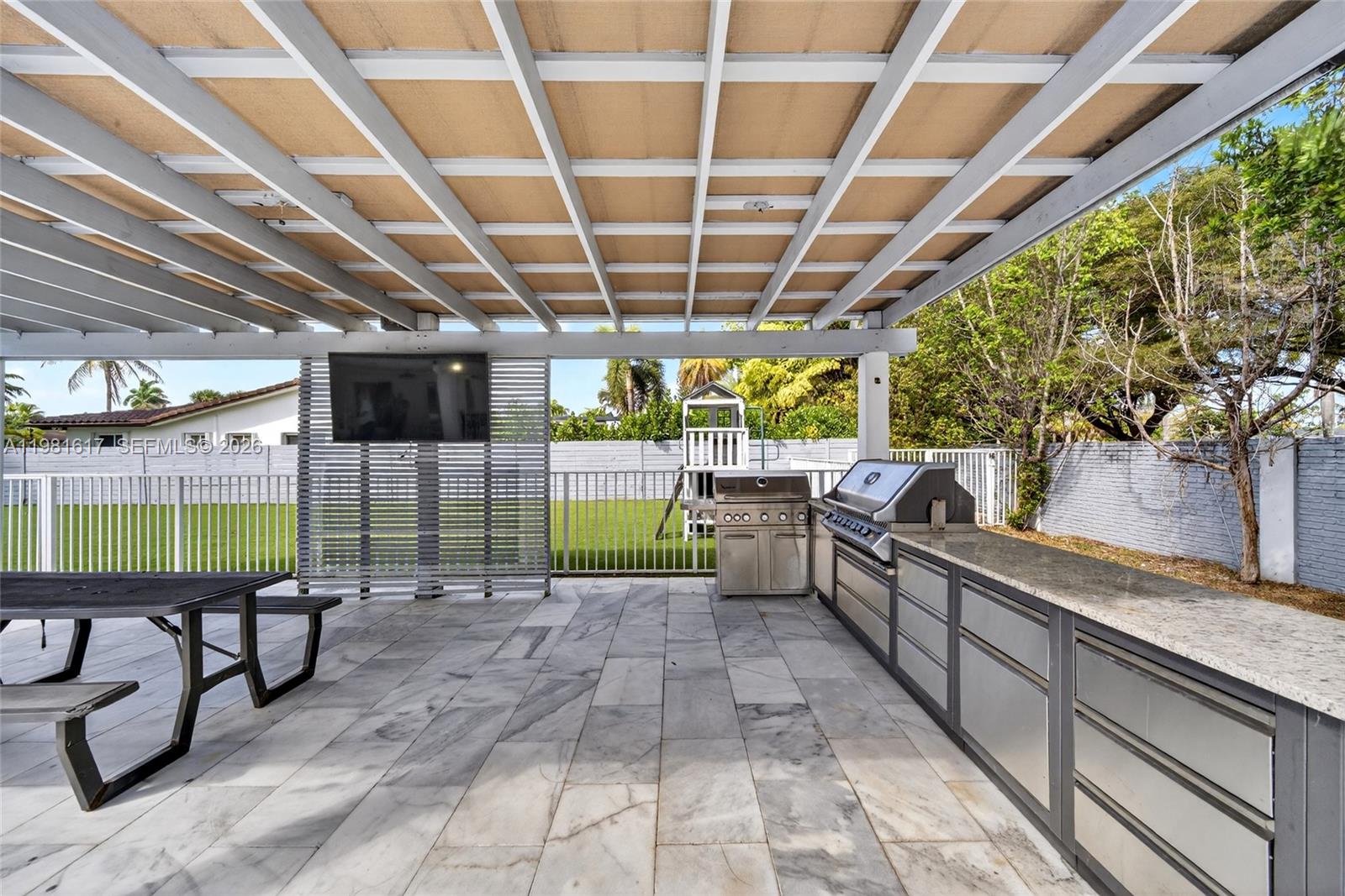 11951 Southwest 120th Terrace Miami, FL 33186 - Photo 44 of 55 a view of a swimming pool with a patio