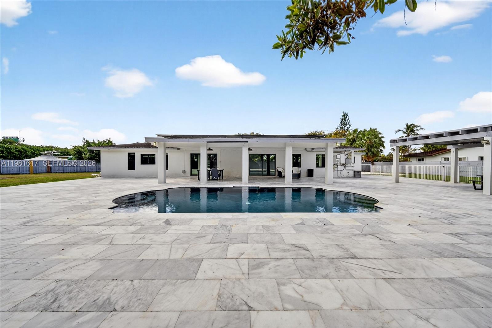 11951 Southwest 120th Terrace Miami, FL 33186 - Photo 46 of 55 a view of house with swimming pool and sitting area