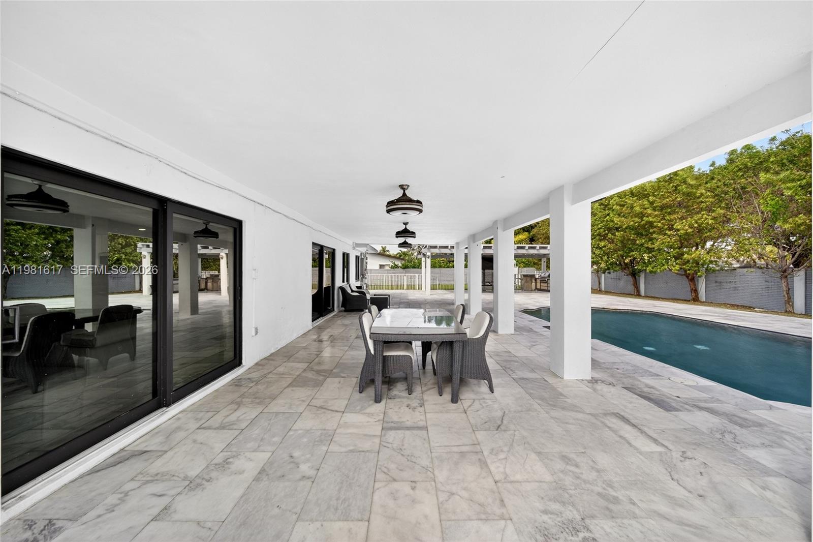11951 Southwest 120th Terrace Miami, FL 33186 - Photo 49 of 55 a view of a dining room with furniture window and outside view