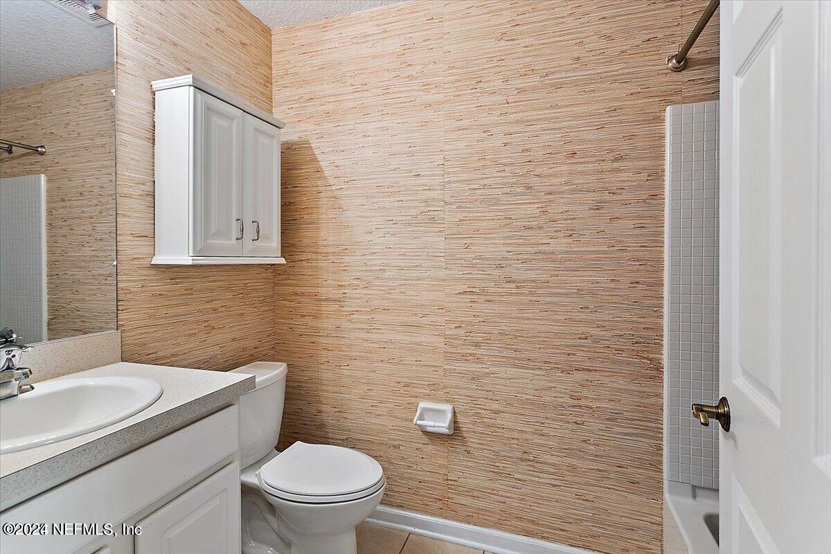 1212 Coghill Circle St. Augustine, FL 32092 - Photo 12 of 18 a bathroom with a toilet a sink and mirror