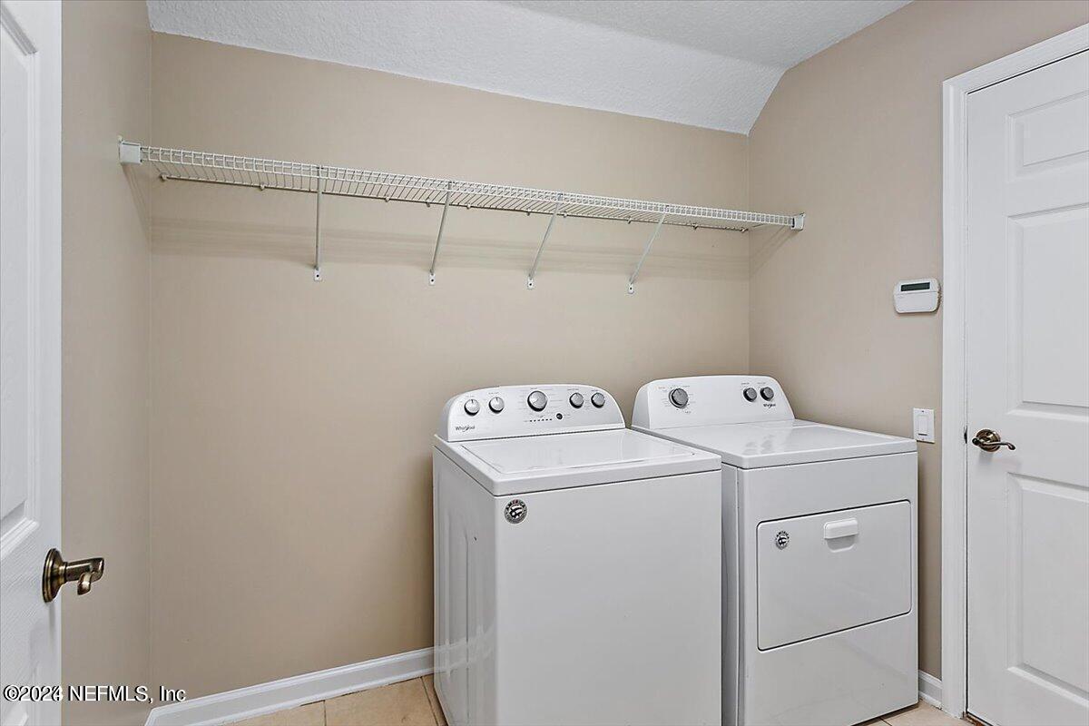 1212 Coghill Circle St. Augustine, FL 32092 - Photo 14 of 18 a utility room with dryer and washer