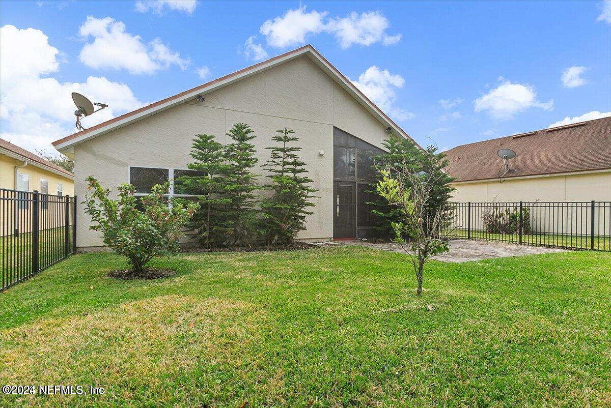 1212 Coghill Circle St. Augustine, FL 32092 - Photo 17 of 18 a house that is sitting in the grass