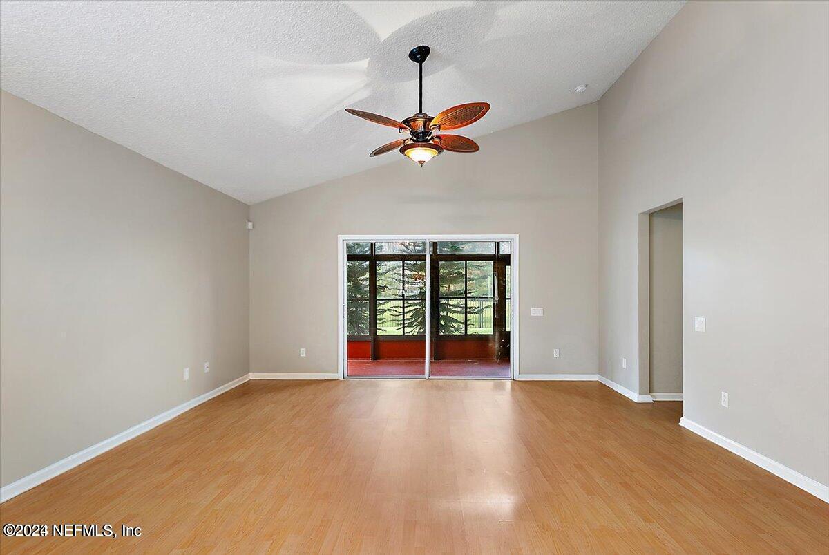 1212 Coghill Circle St. Augustine, FL 32092 - Photo 3 of 18 wooden floor in an empty room with a window