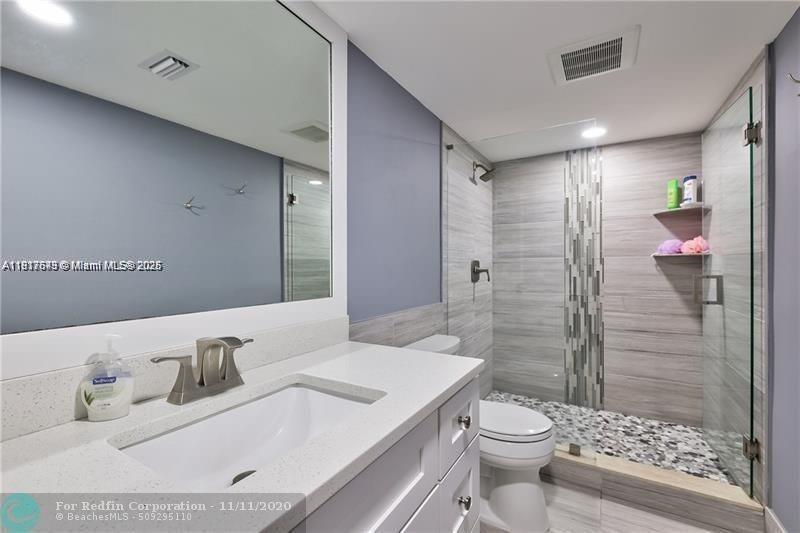 3100 Riverside Drive, Unit 107 Coral Springs, FL 33065 - Photo 4 of 33 a bathroom with a sink toilet and shower