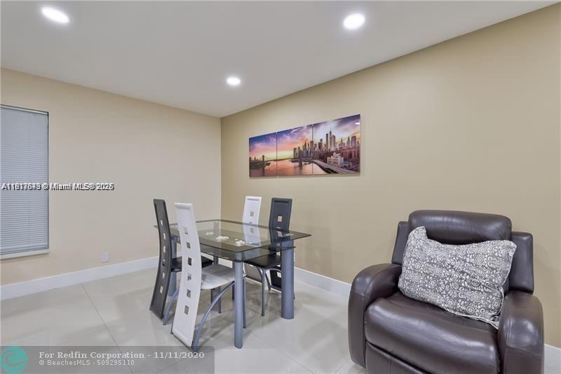 3100 Riverside Drive, Unit 107 Coral Springs, FL 33065 - Photo 7 of 33 a work room with furniture and a couch