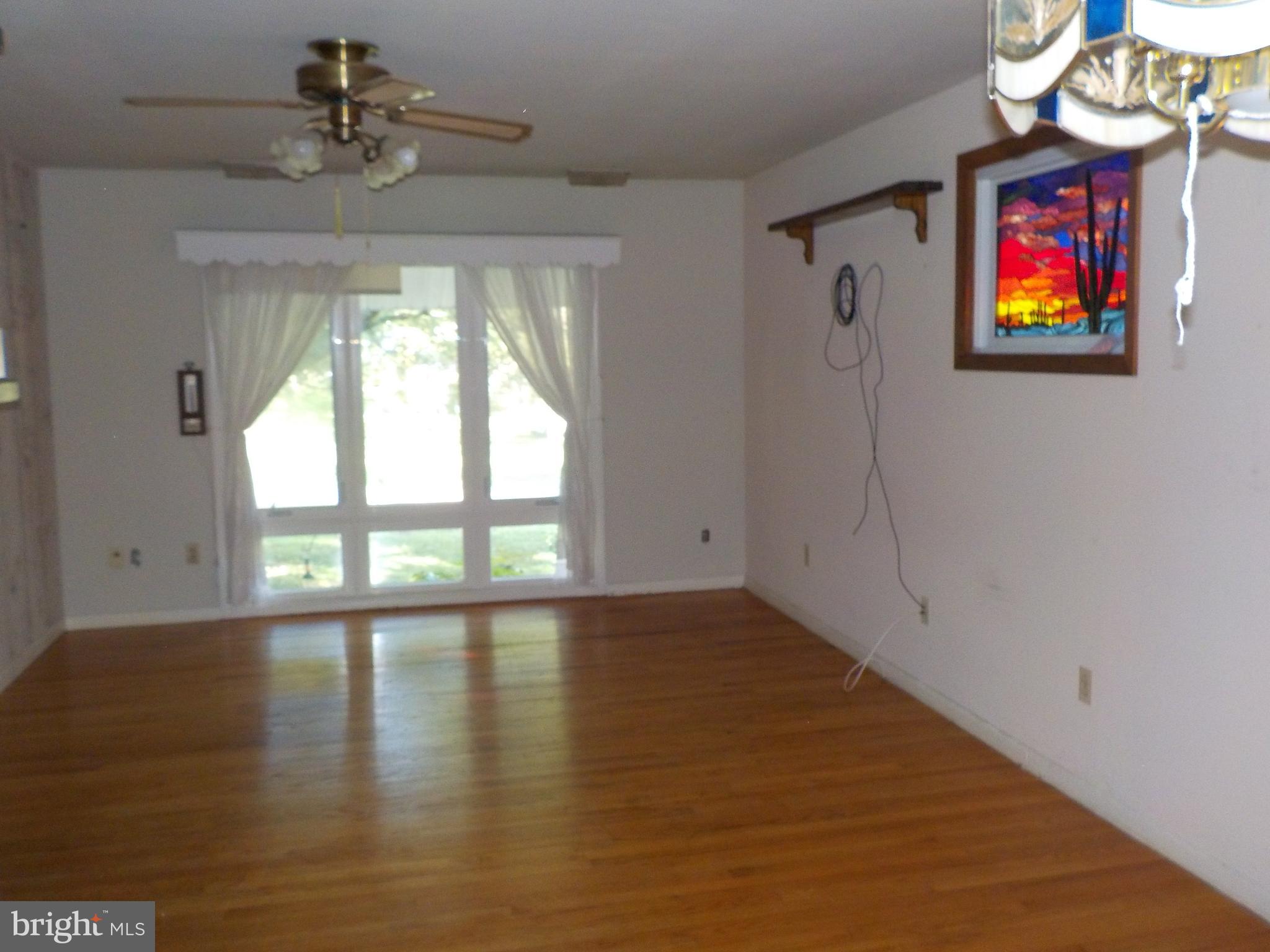 304 Sandy Hill Road Cambridge, MD 21613 - Photo 2 of 22 Living room with hardwood floors