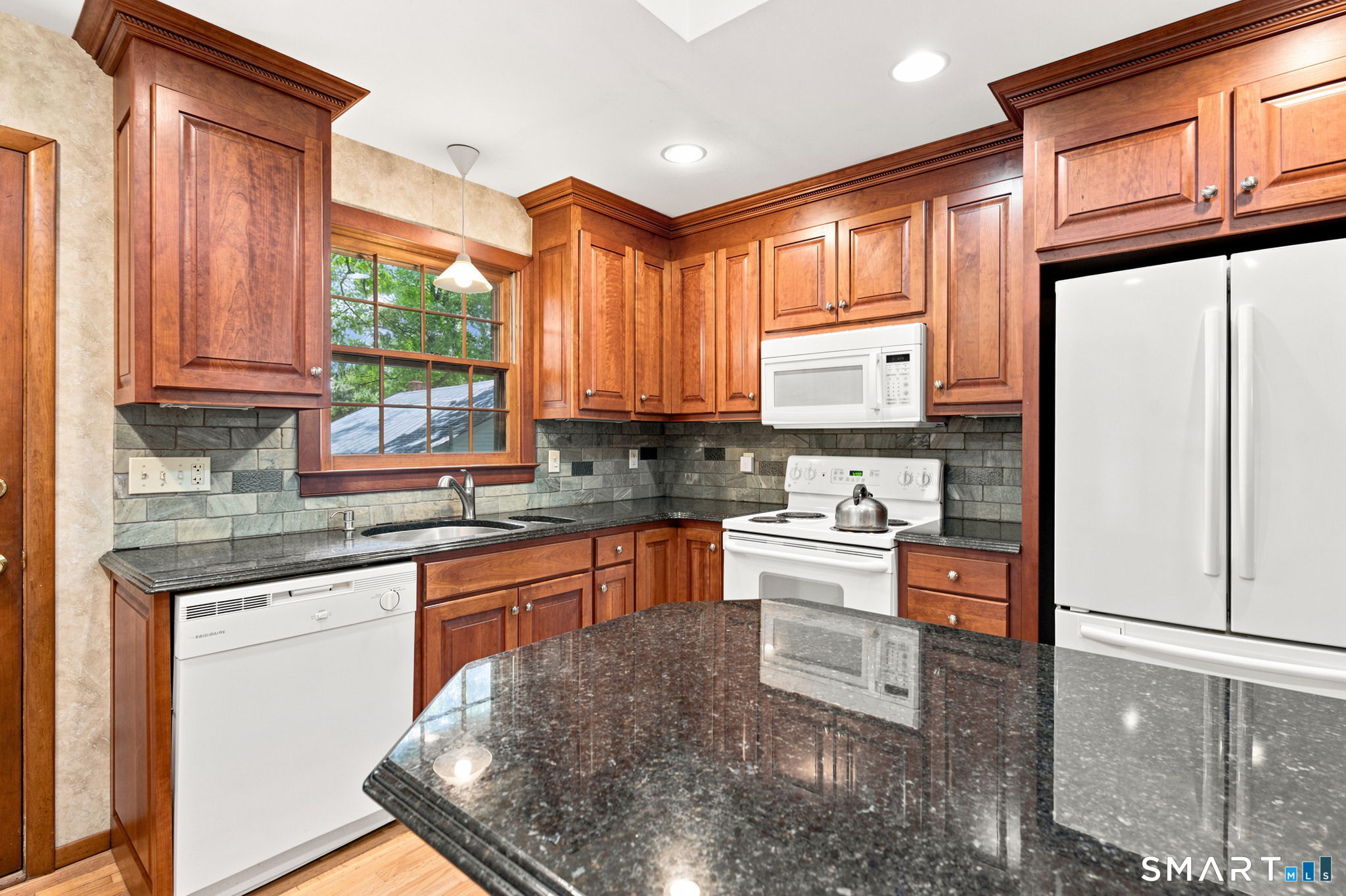 448 Mixville Road Cheshire, CT 06410 - Photo 11 of 32 a kitchen with stainless steel appliances granite countertop a stove a sink dishwasher and a refrigerator