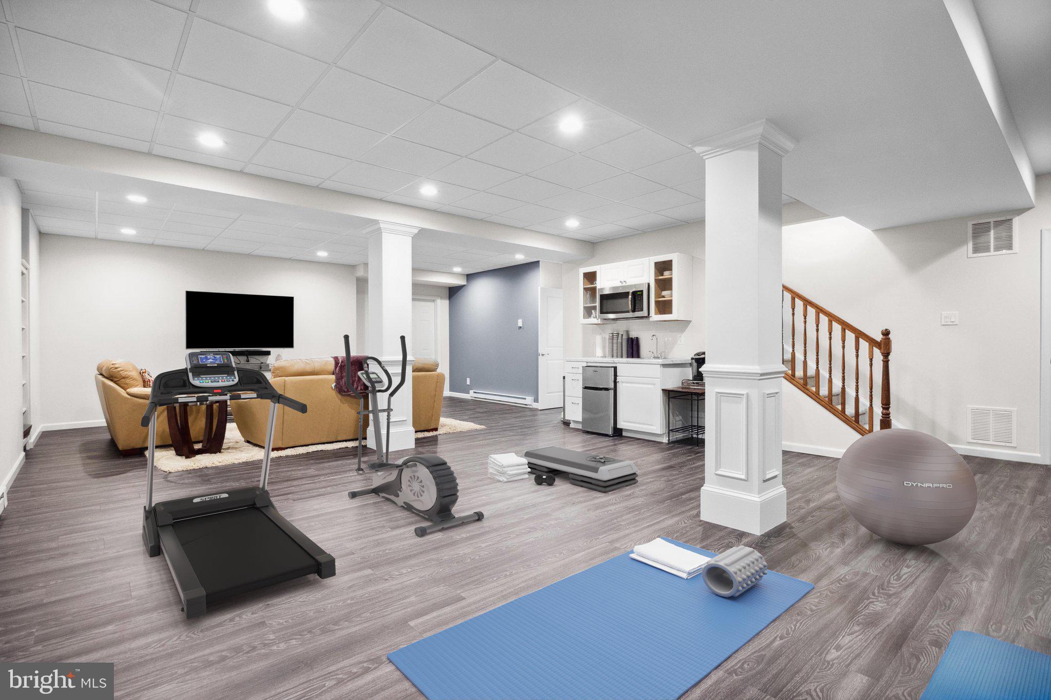 1615 Silver Birch Road Huntingdon Valley, PA 19006 - Photo 32 of 69 a living room with furniture flat screen tv and couches